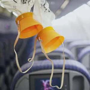 deux masques à oxygène dans un avion